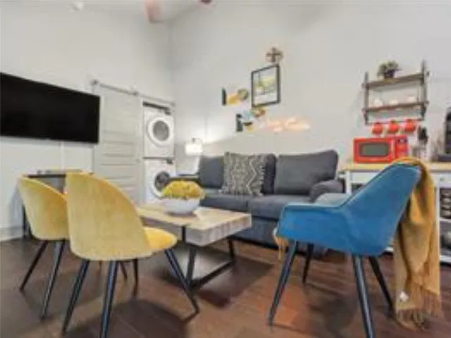 a living room with furniture and a flat screen tv