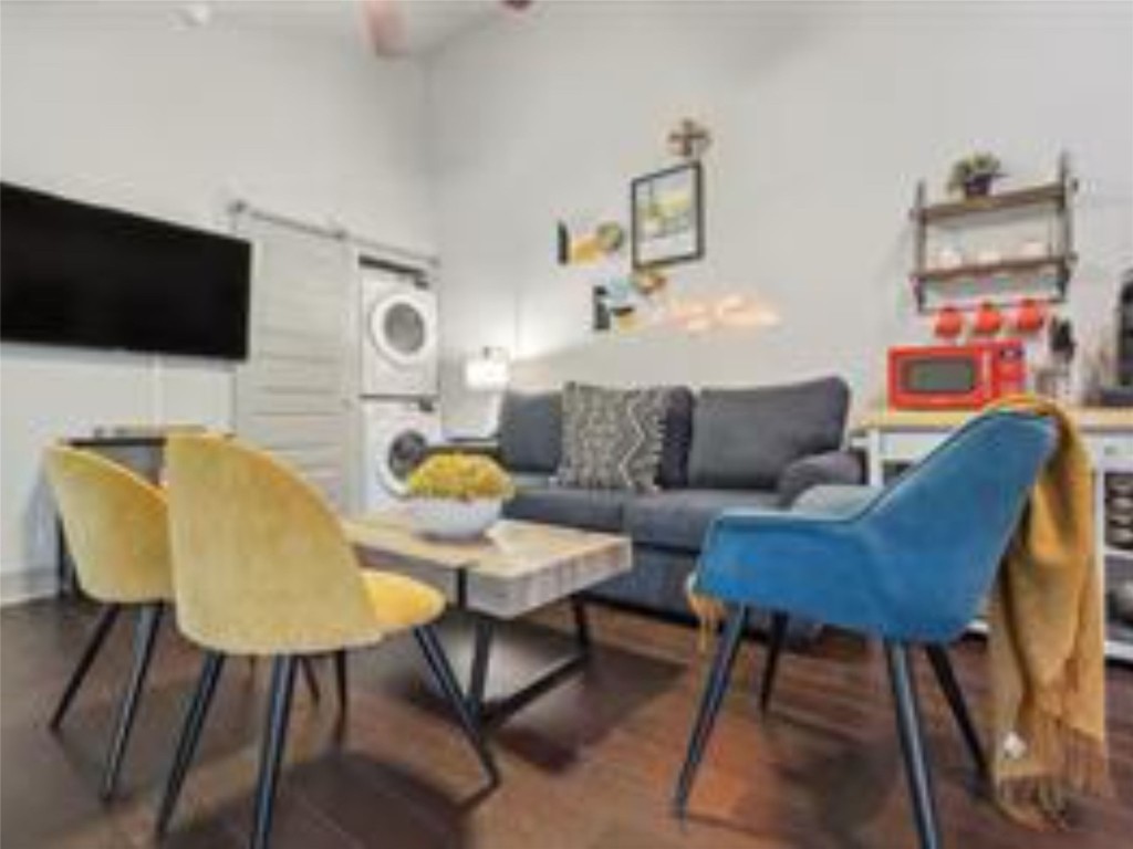 1139 1/2 Poquito Street, Unit 3 Austin, TX 78702 - Photo 6 of 23 a living room with furniture and a flat screen tv