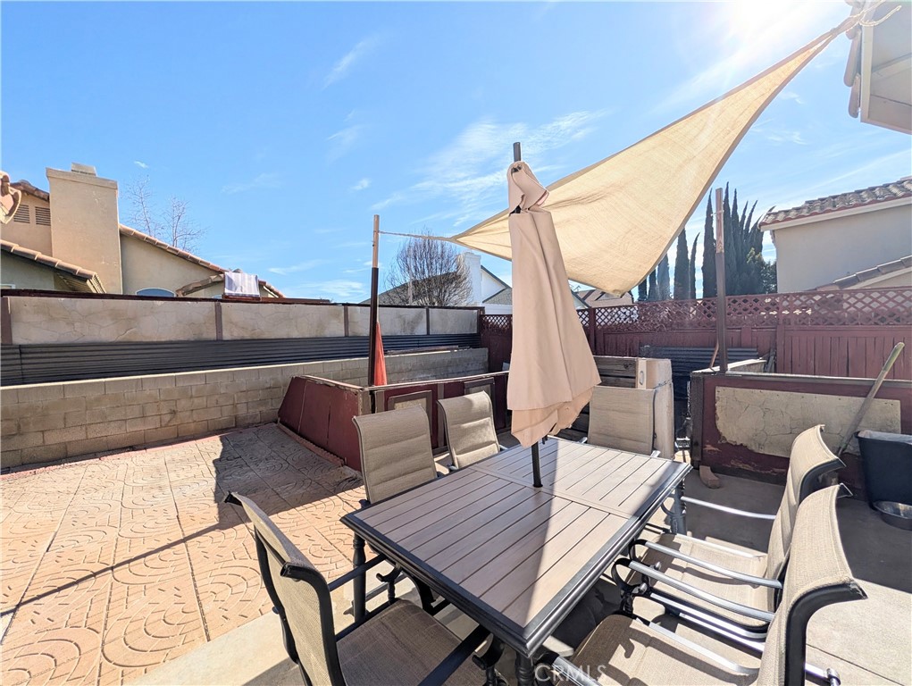 1114 Radka Avenue Beaumont, CA 92223 - Photo 41 of 53 a terrace with outdoor seating and wooden floor