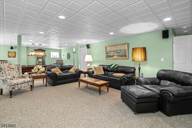 15 Bracken Hill Road Hamburg, NJ 07419 - Photo 30 of 44 a living room with furniture and a wooden floor