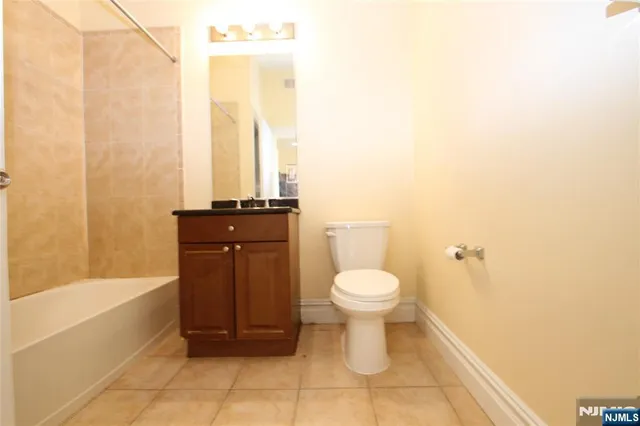 a bathroom with a toilet and a bathtub