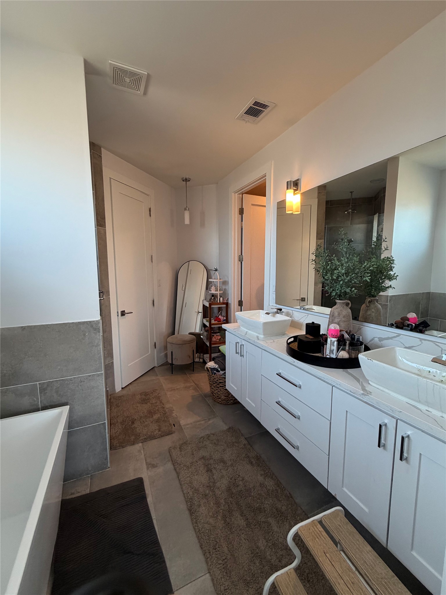 17216 Lund - Carlson Road Elgin, TX 78621 - Photo 8 of 17 Bathroom featuring double vanity, a soaking tub, and a stall shower