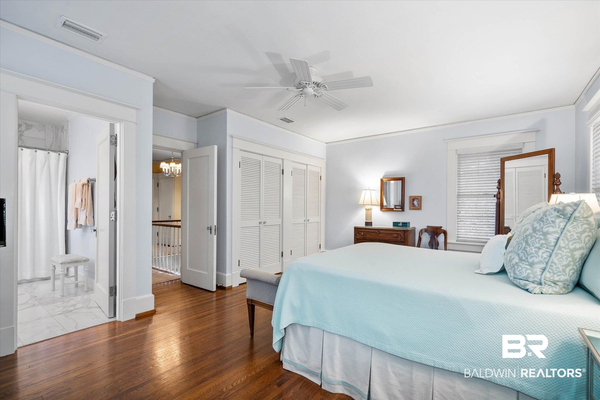 2 Westgate Road Mobile, AL 36608 - Photo 26 of 63 Bedroom with a closet, ceiling fan, wood finished floors, hanging lights, and ensuite bath