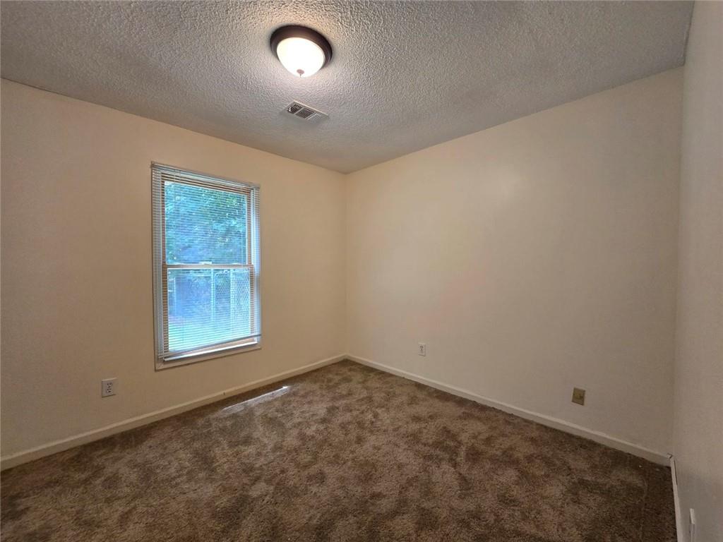 375 Old Brock Road Rockmart, GA 30153 - Photo 13 of 16 an empty room with a window