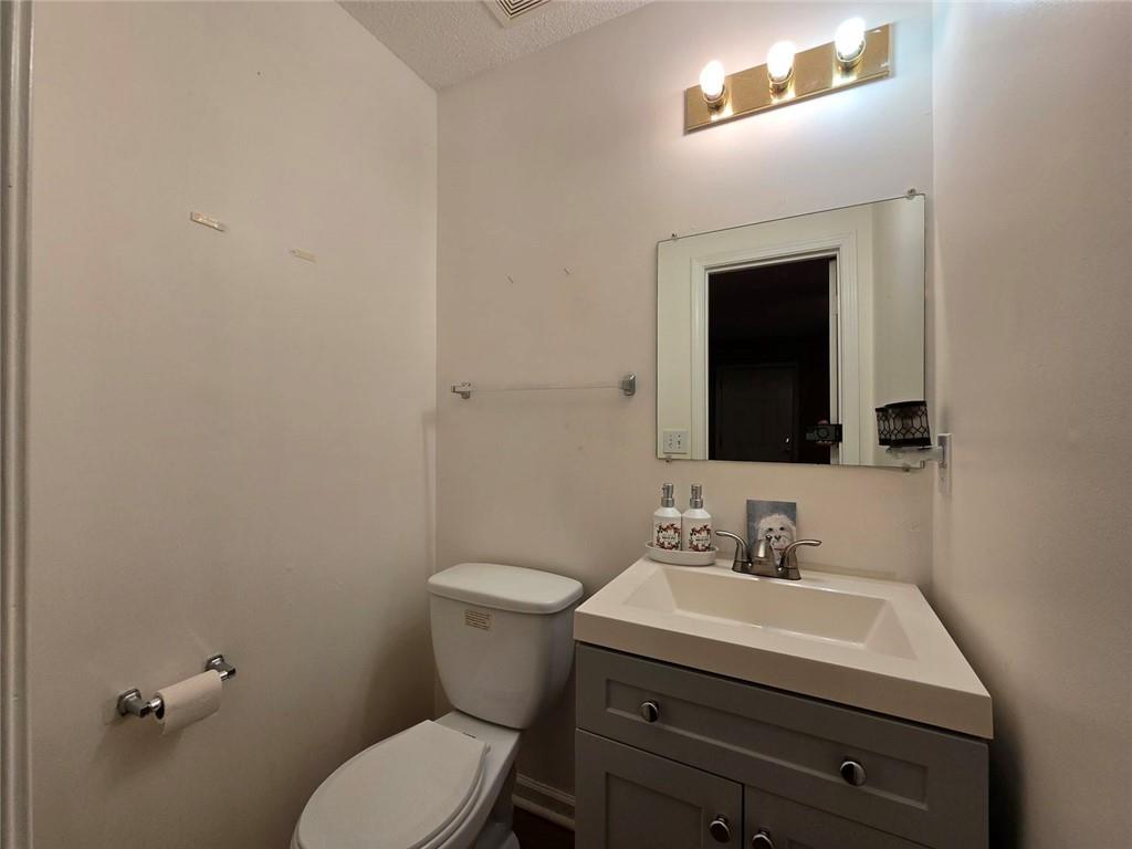 375 Old Brock Road Rockmart, GA 30153 - Photo 14 of 16 a bathroom with a sink mirror and toilet