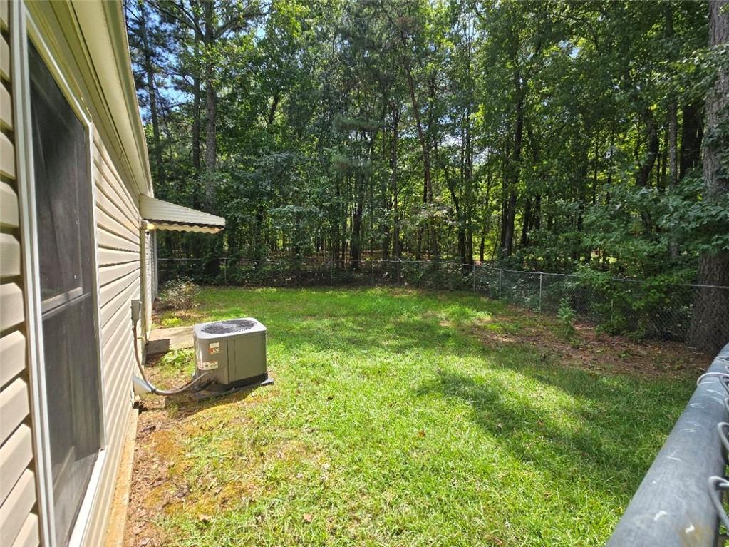 375 Old Brock Road Rockmart, GA 30153 - Photo 15 of 16 a backyard of a house with table and chairs