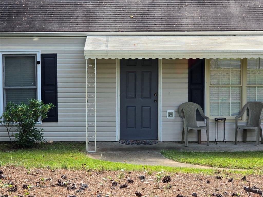 375 Old Brock Road Rockmart, GA 30153 - Photo 2 of 16 a view of a house with swimming pool and sitting area