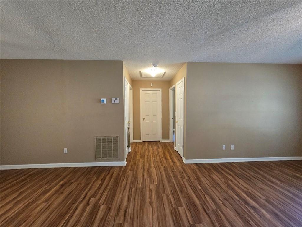 375 Old Brock Road Rockmart, GA 30153 - Photo 7 of 16 a view of wooden floor and windows in a room