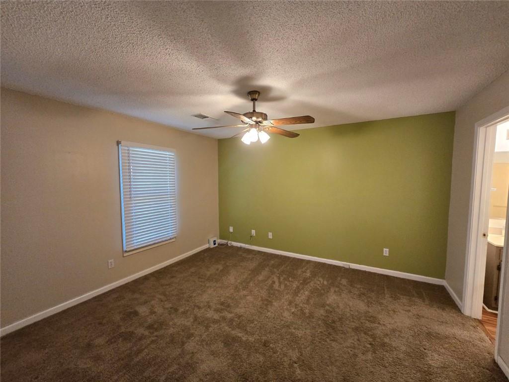 375 Old Brock Road Rockmart, GA 30153 - Photo 8 of 16 a view of a room with a ceiling fan and a window