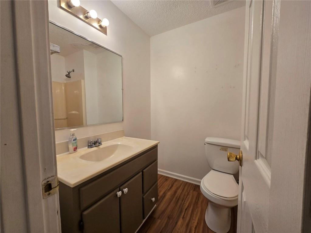 375 Old Brock Road Rockmart, GA 30153 - Photo 10 of 16 a bathroom with a sink toilet and vanity