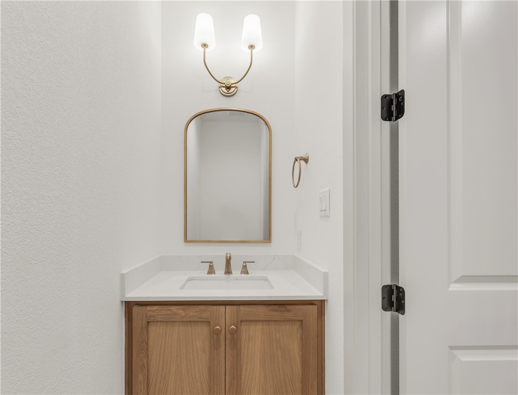 4007 Pacific Crest Way Bryan, TX 77802 - Photo 32 of 43 a bathroom with a sink and a mirror