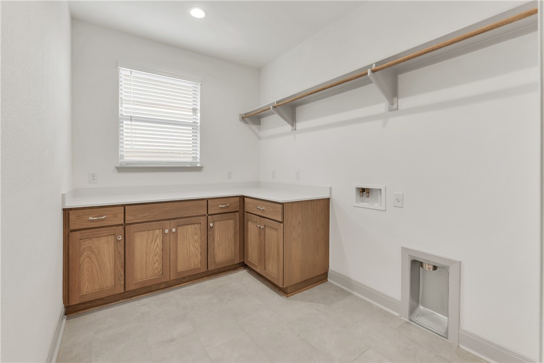4007 Pacific Crest Way Bryan, TX 77802 - Photo 33 of 43 a view of a kitchen with cabinets