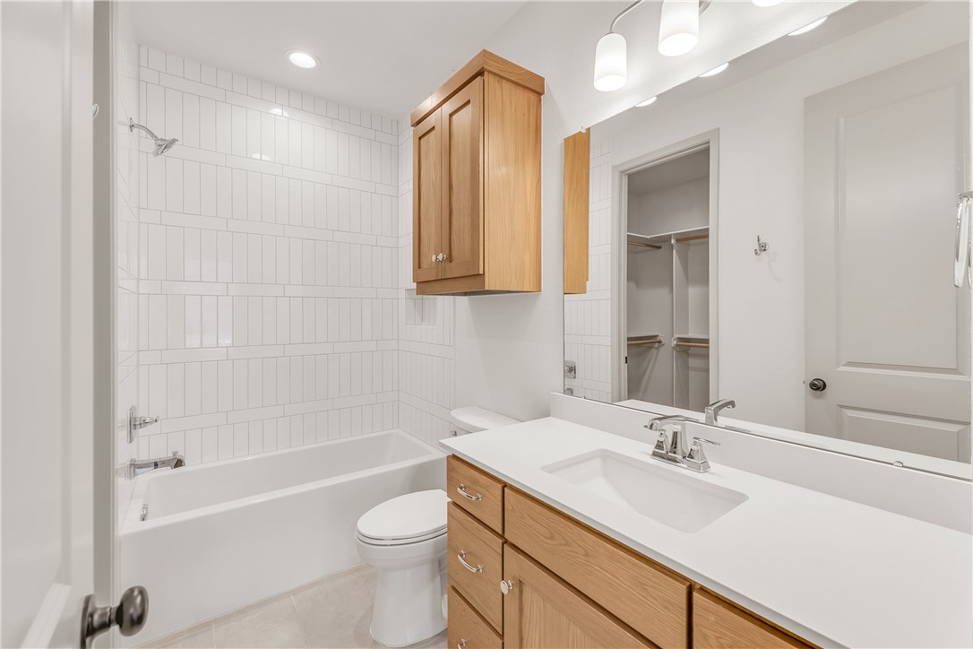 4007 Pacific Crest Way Bryan, TX 77802 - Photo 35 of 43 a bathroom with a sink a toilet and bathtub