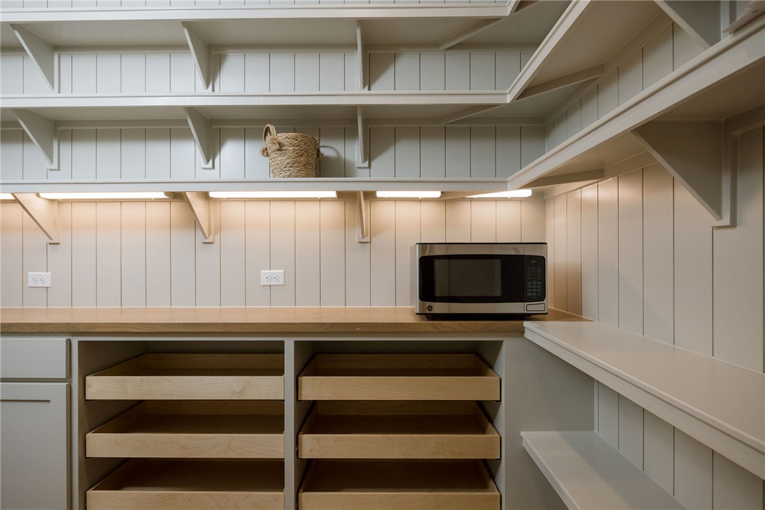 4007 Pacific Crest Way Bryan, TX 77802 - Photo 10 of 28 a kitchen with a microwave and cabinets