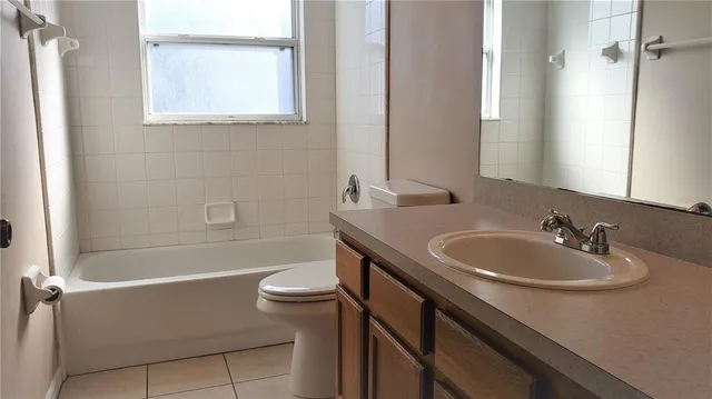 a bathroom with a sink a toilet and a bathtub
