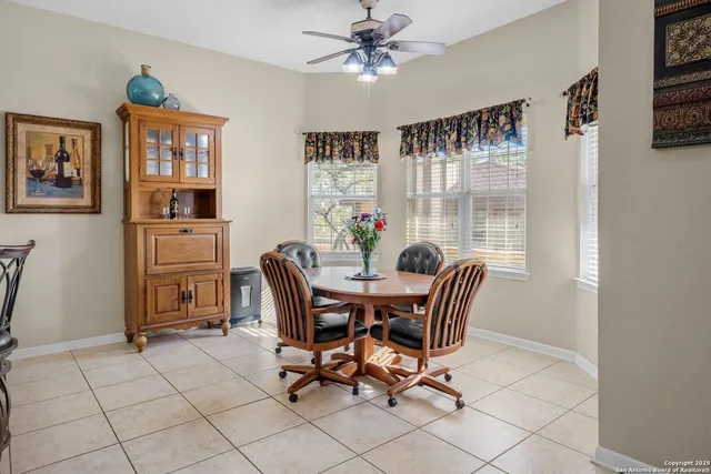 a kitchen with stainless steel appliances granite countertop a stove refrigerator and cabinets