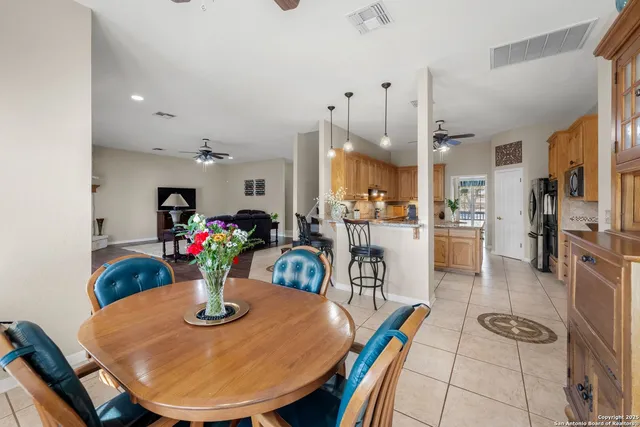 a kitchen with stainless steel appliances kitchen island granite countertop a sink and cabinets