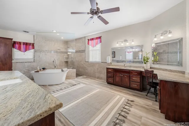 a bathroom with a bathtub and shower