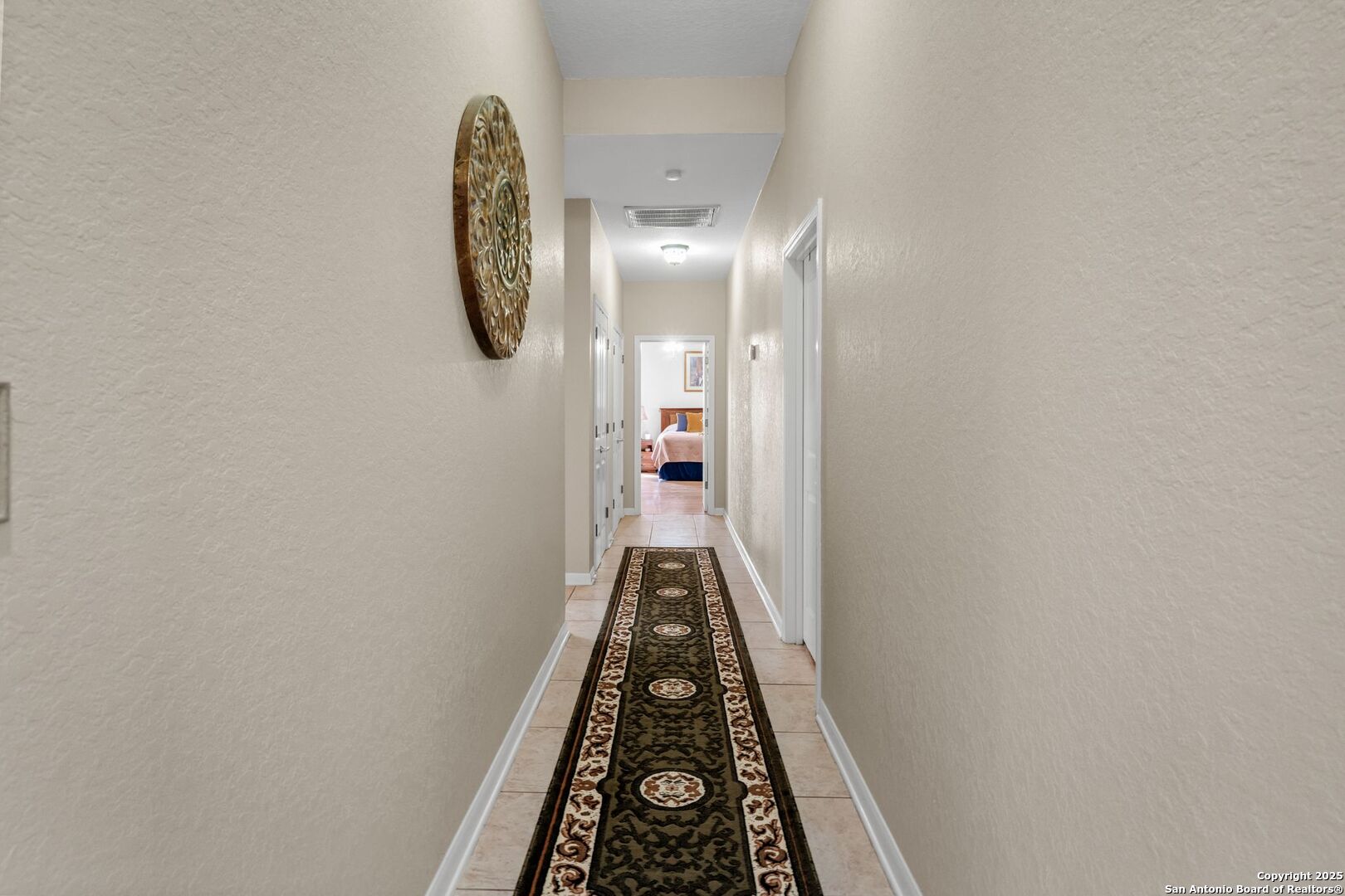 765 Highway 1604 Loop St. Hedwig, TX 78101 - Photo 20 of 50 a view of a hallway with wooden floor and front door