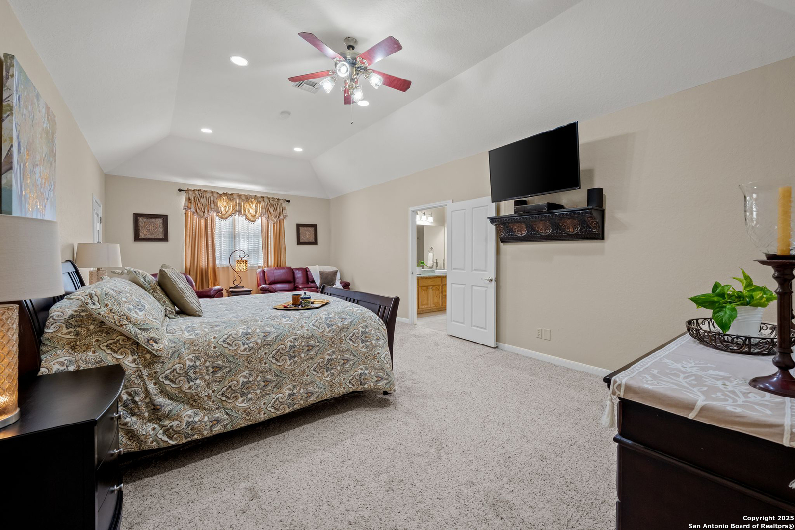 765 Highway 1604 Loop St. Hedwig, TX 78101 - Photo 21 of 50 a bedroom with a bed and a flat screen tv