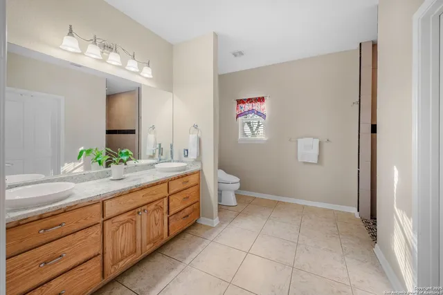 a spacious bedroom with a bed and a large window