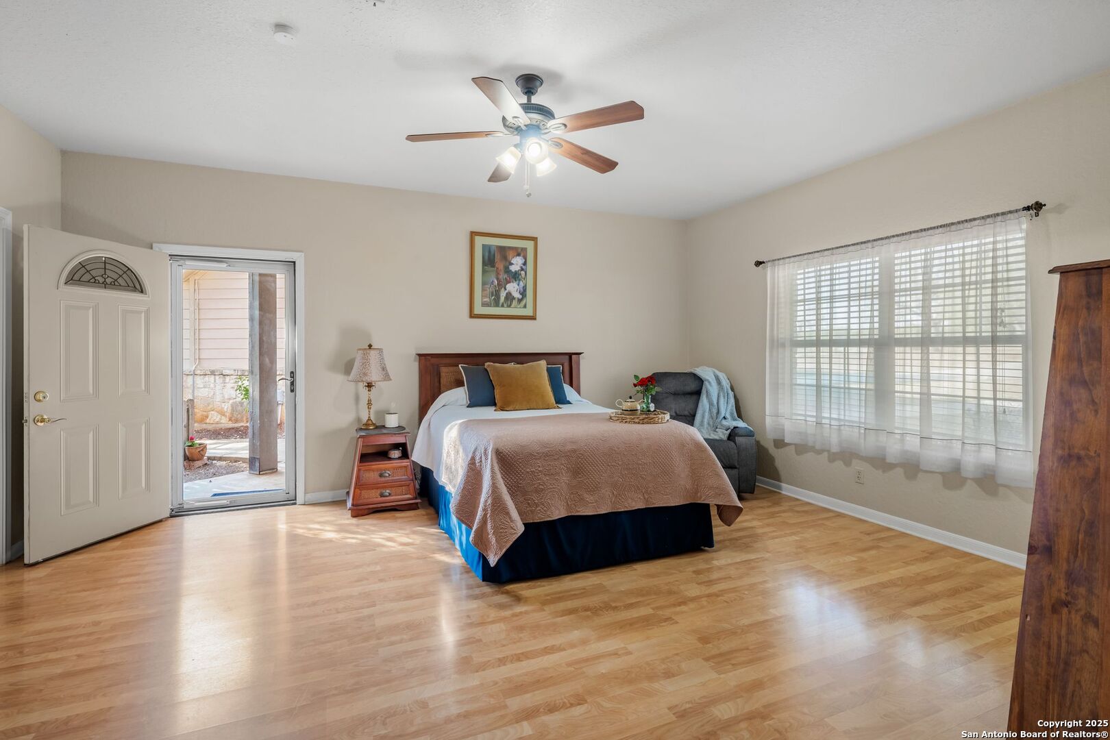 765 Highway 1604 Loop St. Hedwig, TX 78101 - Photo 25 of 50 a spacious bedroom with a bed and a large window