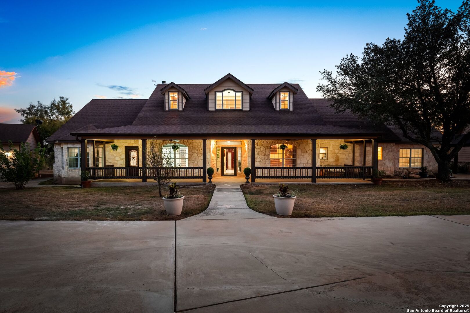 765 Highway 1604 Loop St. Hedwig, TX 78101 - Photo 3 of 50 a front view of a house with garden