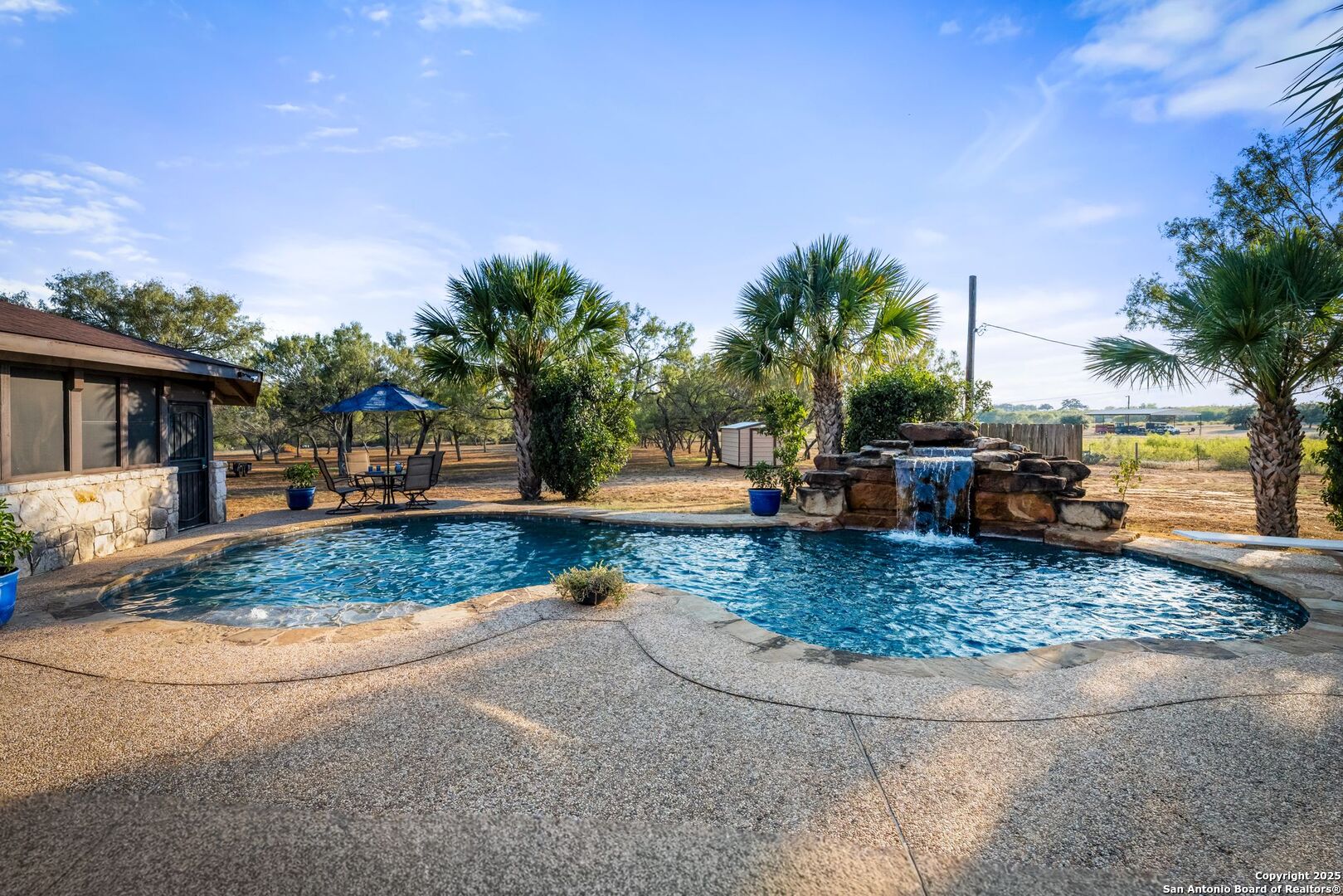 765 Highway 1604 Loop St. Hedwig, TX 78101 - Photo 32 of 50 a view of a backyard with large trees