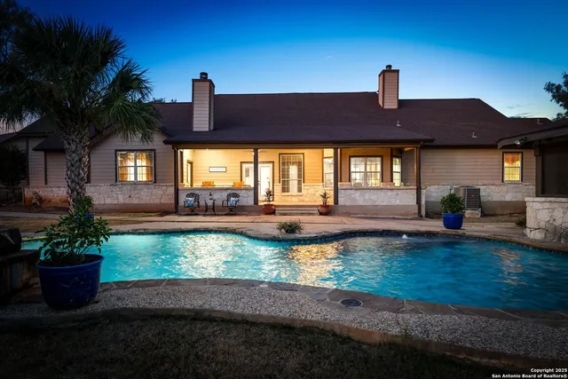 a view of a swimming pool with a patio