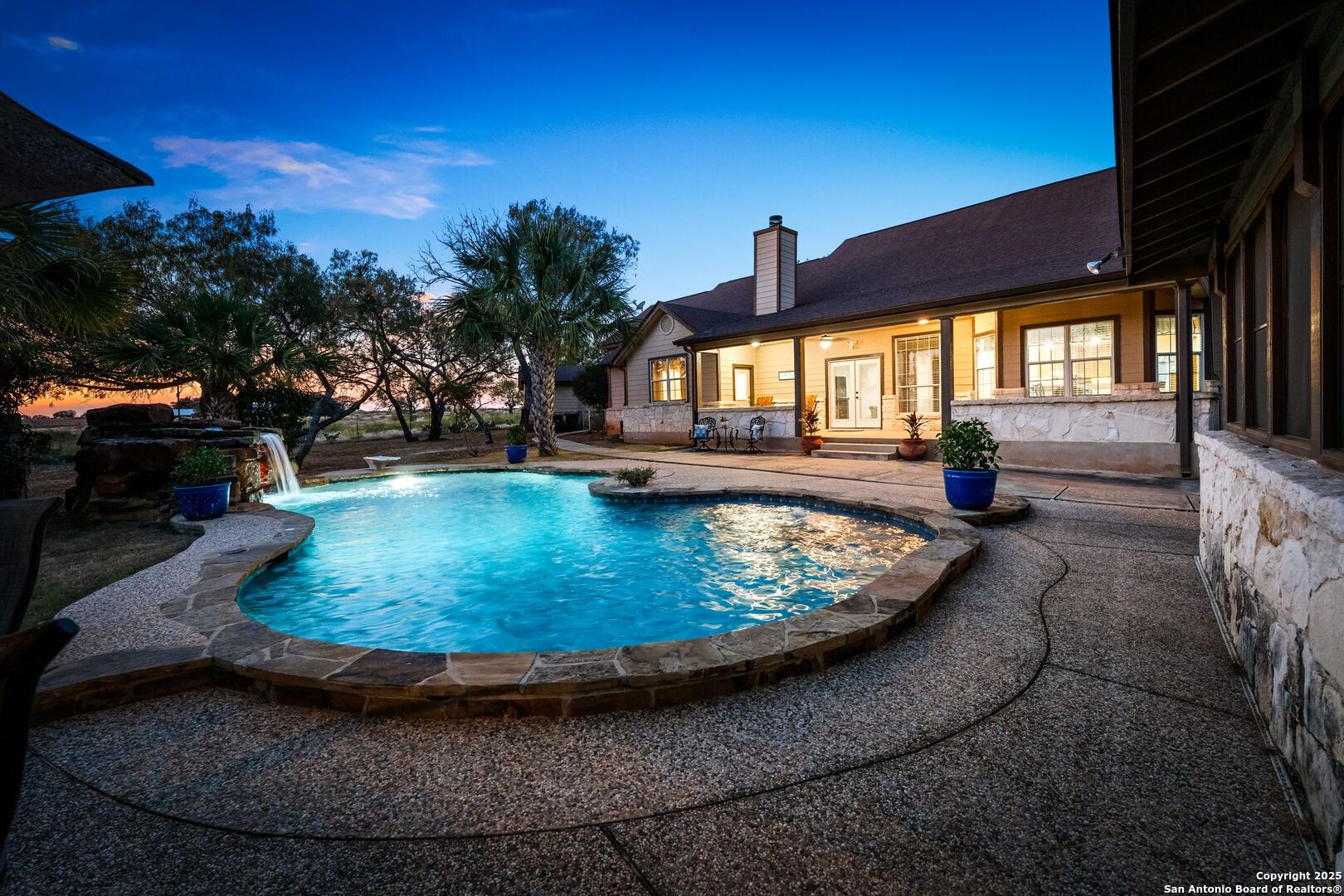 765 Highway 1604 Loop St. Hedwig, TX 78101 - Photo 38 of 50 a view of a swimming pool with a patio
