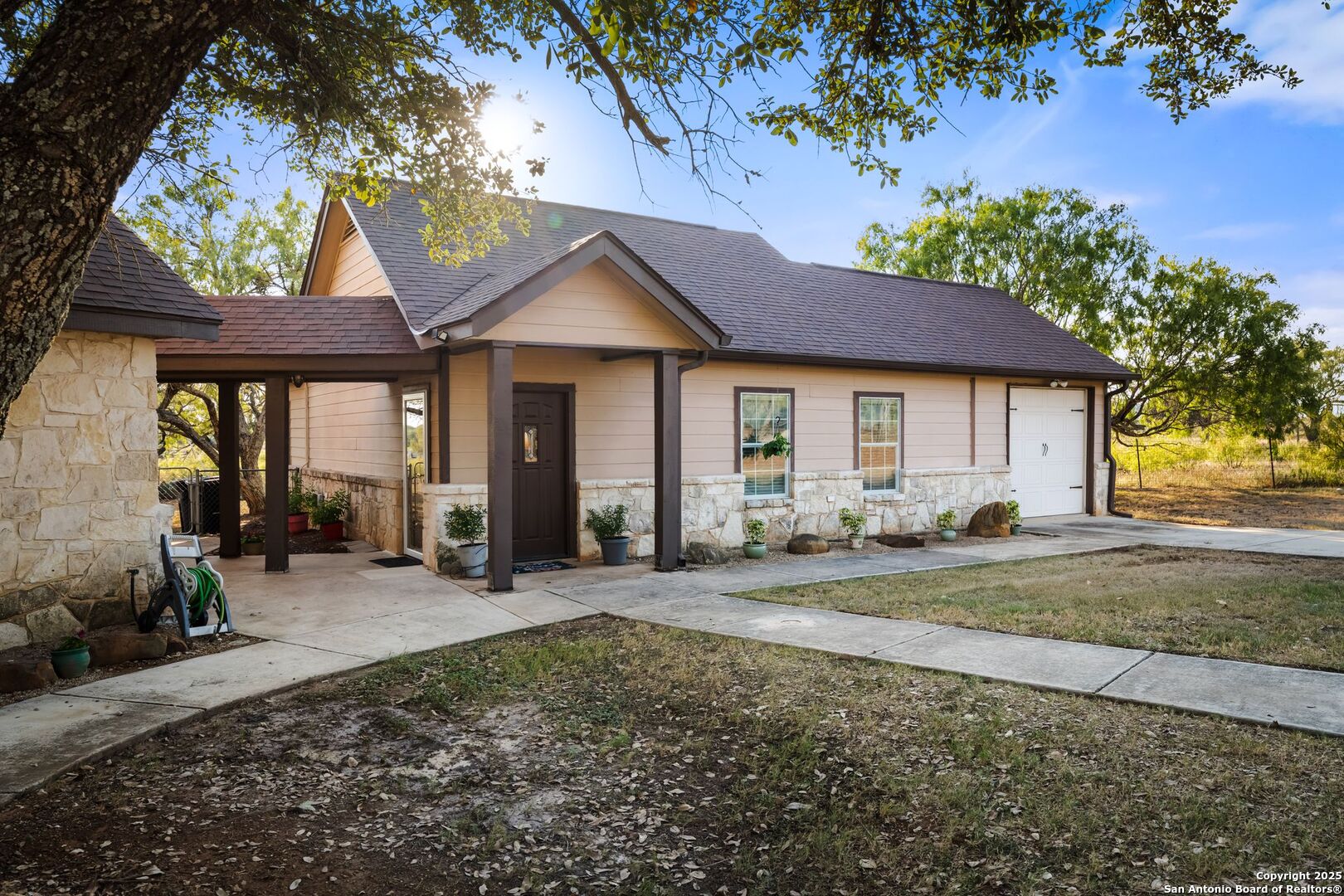 765 Highway 1604 Loop St. Hedwig, TX 78101 - Photo 40 of 50 a front view of a house with yard and seating space