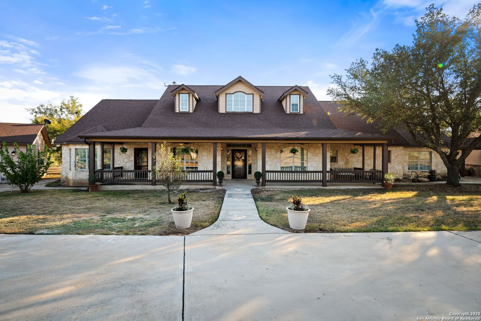 765 Highway 1604 Loop St. Hedwig, TX 78101 - Photo 4 of 50 a front view of a house with swimming pool