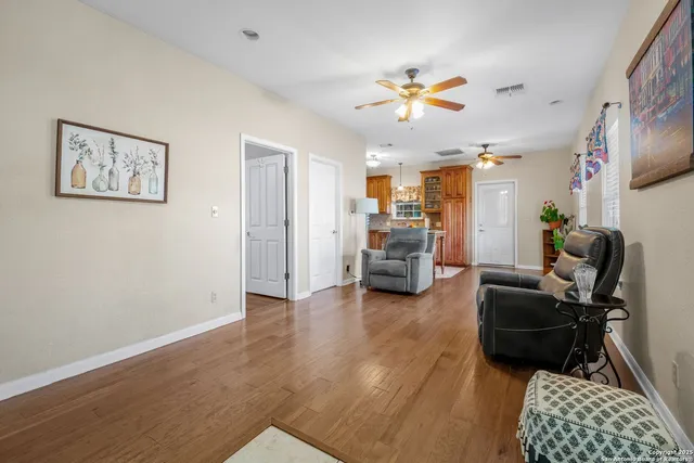 a kitchen with stainless steel appliances granite countertop a refrigerator a sink a stove and island