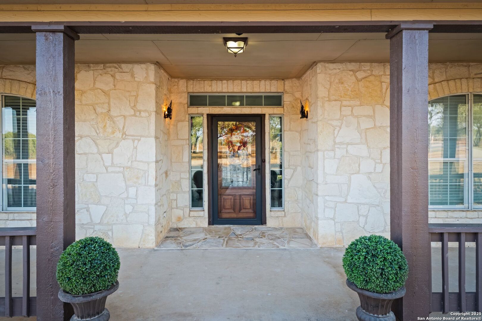 765 Highway 1604 Loop St. Hedwig, TX 78101 - Photo 6 of 50 a front view of a house with garden