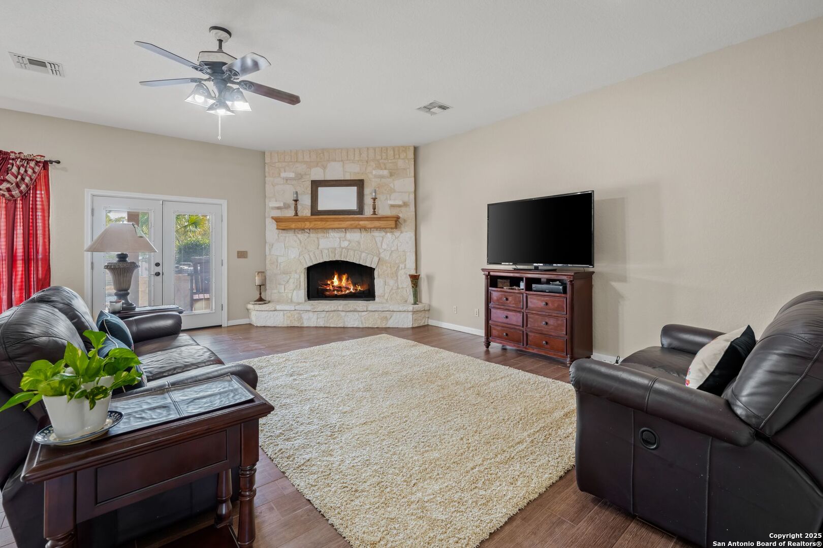 765 Highway 1604 Loop St. Hedwig, TX 78101 - Photo 8 of 50 a living room with furniture and a fireplace