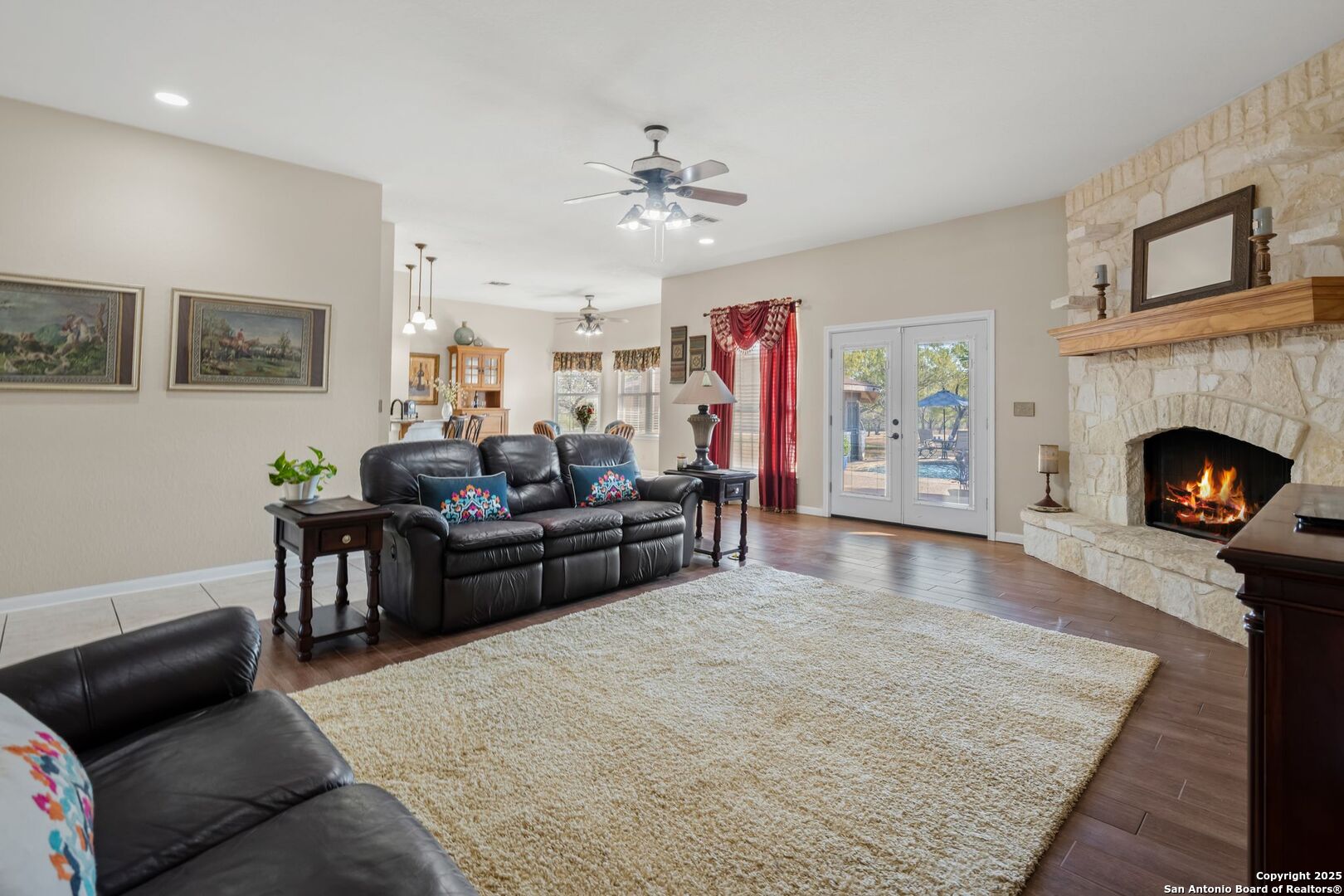 765 Highway 1604 Loop St. Hedwig, TX 78101 - Photo 9 of 50 a living room with furniture and a fireplace