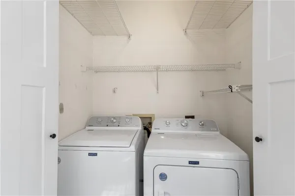 a utility room with dryer and washer