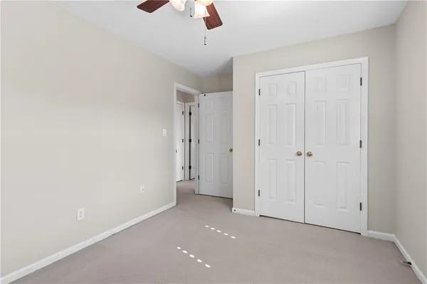 a living room with furniture a couch and a flat screen tv