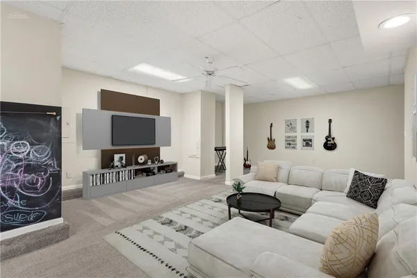 a living room with furniture and a fireplace
