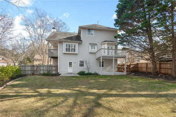 a view of a backyard with a large tree