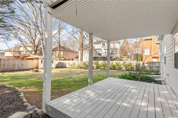 a view of a chairs and table in patio