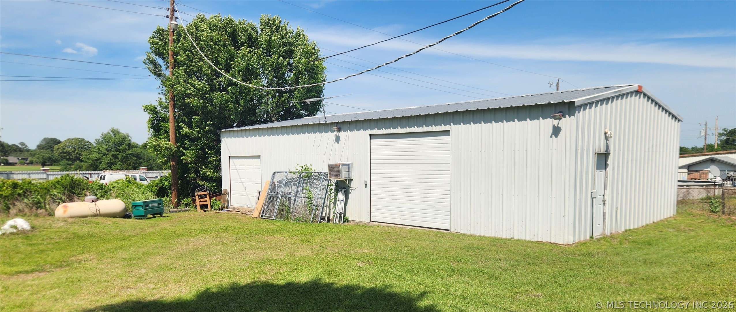 149 West Ruth Atoka, OK 74525 - Photo 4 of 62 Metal utility building featuring a corrugated metal exterior and a metal roof