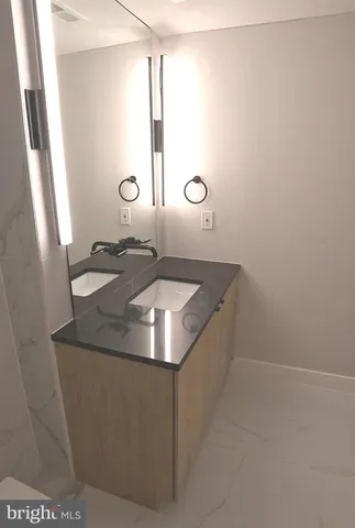 a sink sitting next to a bathroom sink