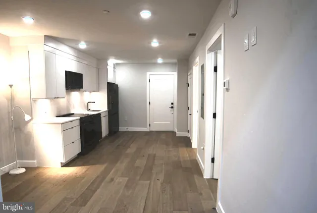 a view of a kitchen with electric appliances