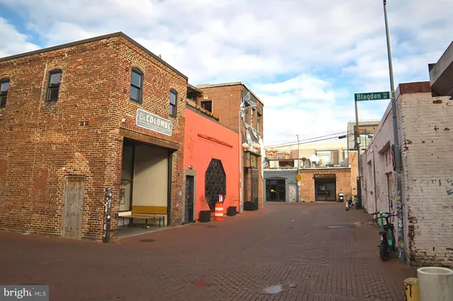 a view of a street with a building