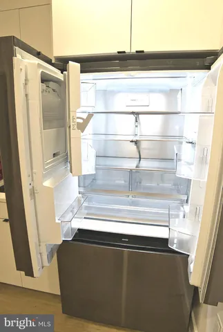 a kitchen with a sink and a refrigerator