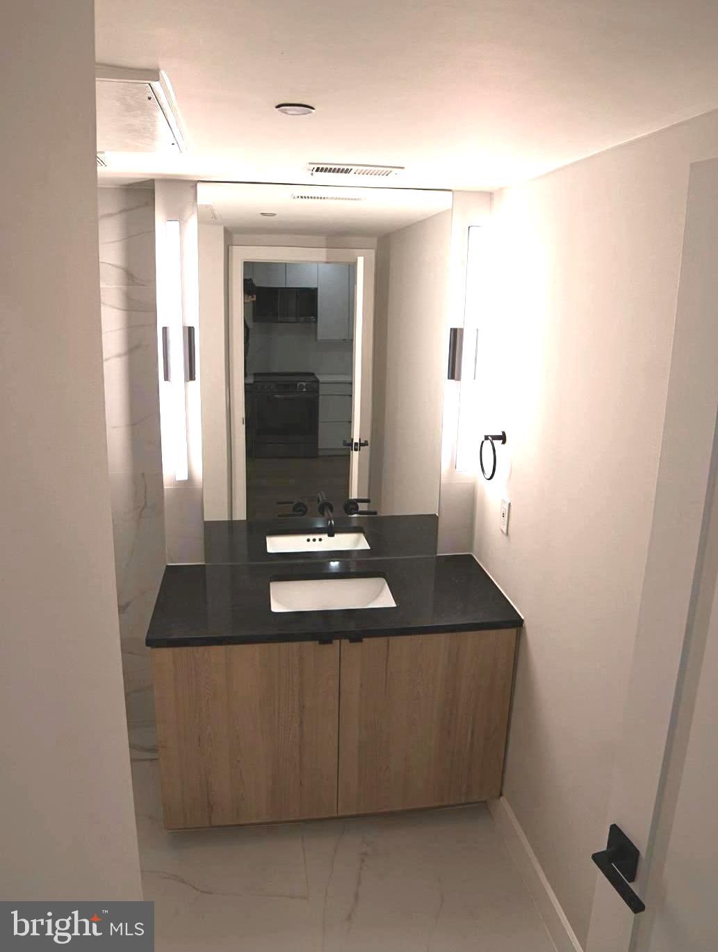 1208 M Street Northwest, Unit 2 Washington, DC 20005 - Photo 9 of 25 a living room with furniture and a window