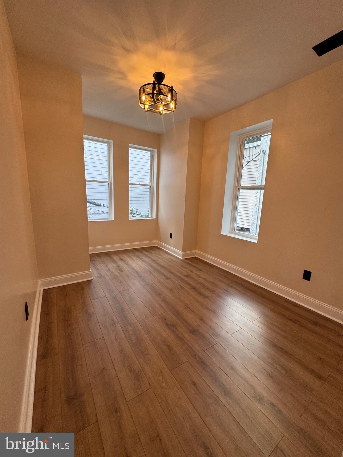856 Perkiomen Street Philadelphia, PA 19130 - Photo 11 of 29 a view of an empty room with wooden floor and a window