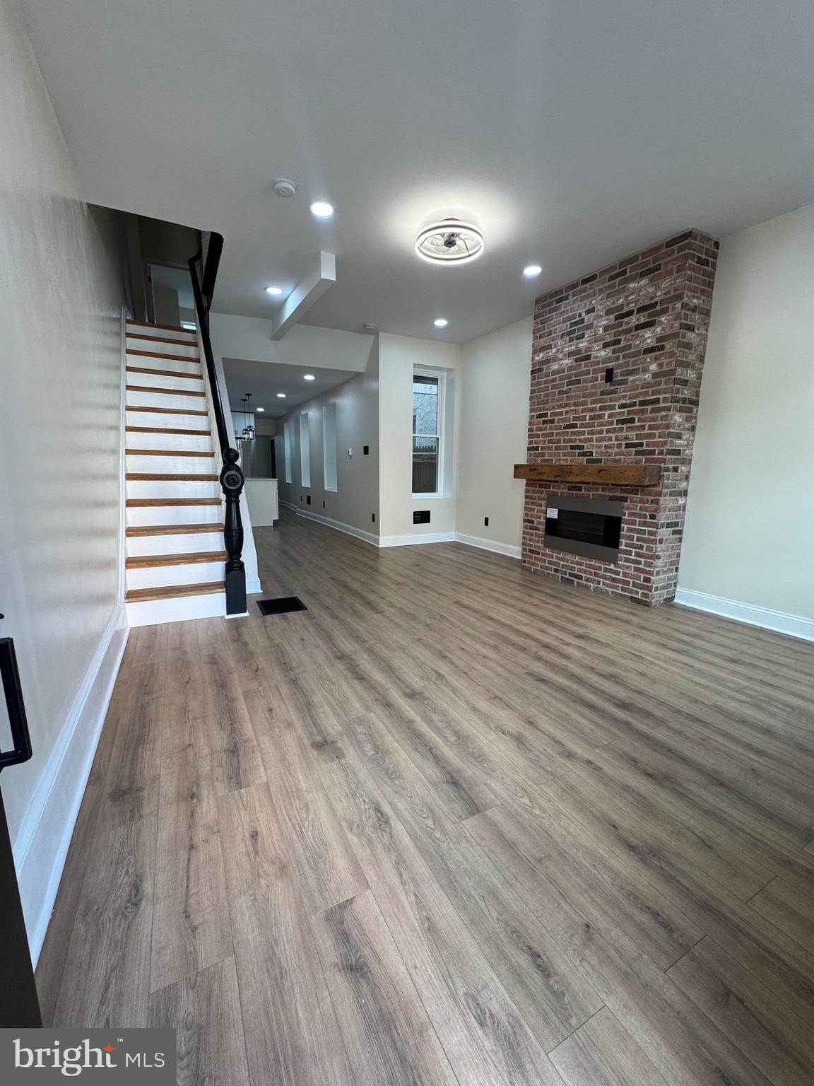 856 Perkiomen Street Philadelphia, PA 19130 - Photo 2 of 29 a view of a livingroom with wooden floor and staircase