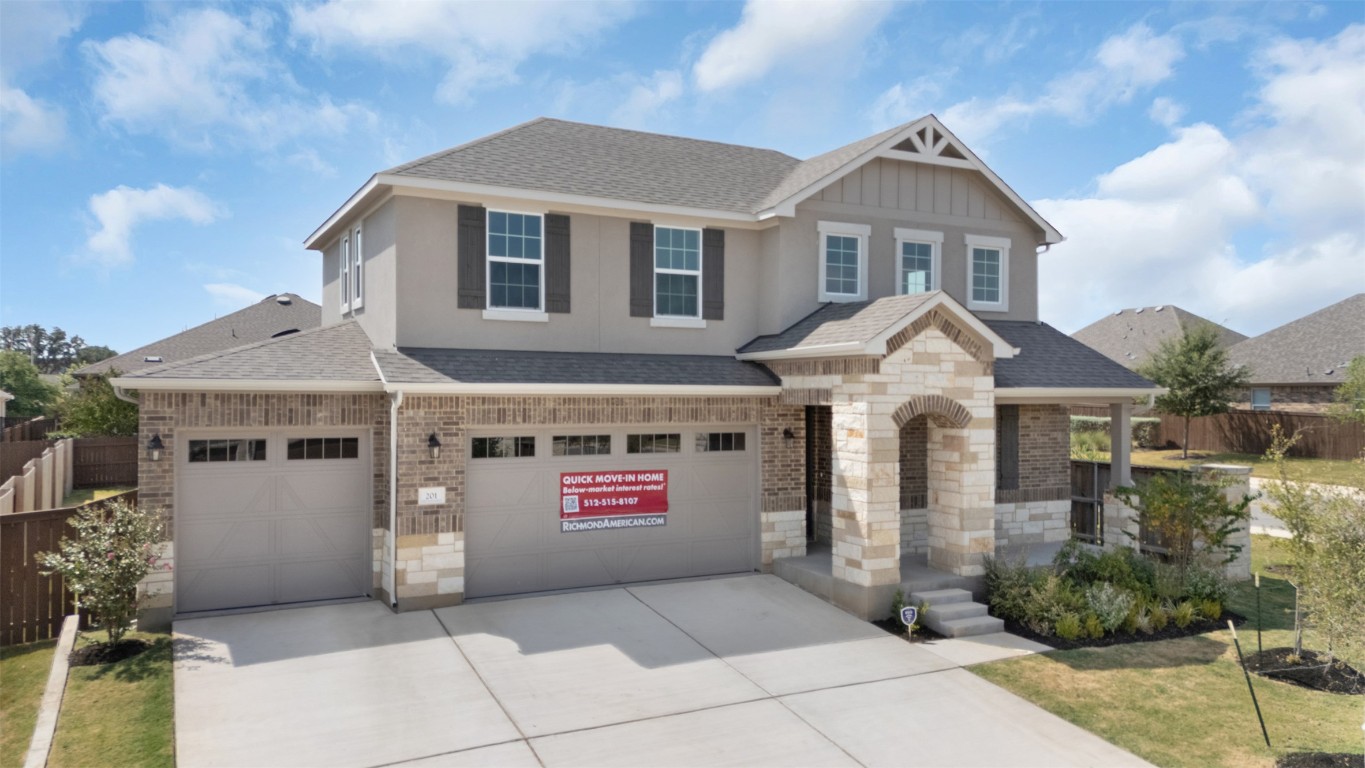 Craftsman-style house with a shingled roof, an attached garage, driveway, and brick siding